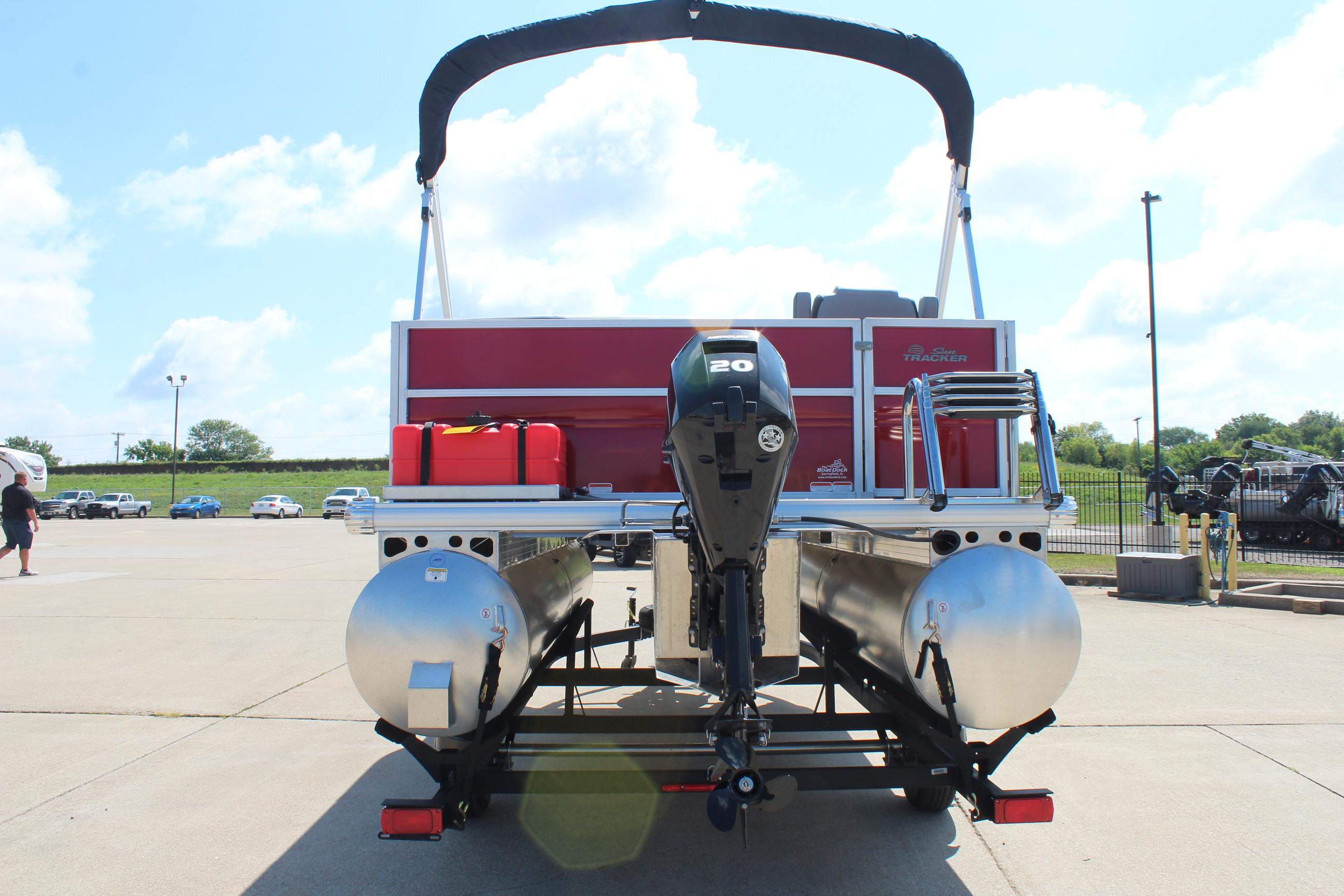 2026 Sun Tracker Party Barge 16 DLX pontoon boat with outboard motor, rear view.