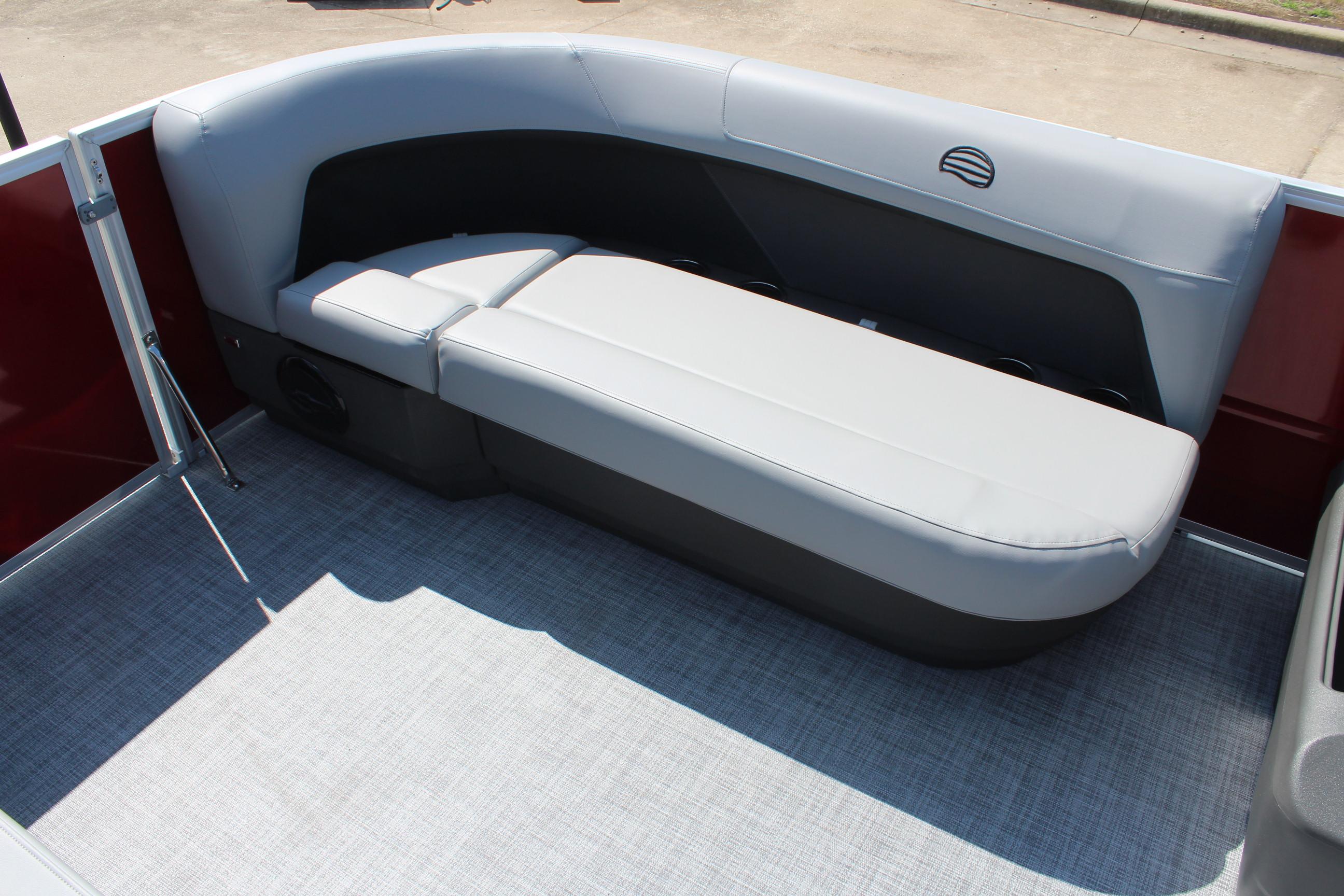 2026 Sun Tracker Party Barge 16 DLX interior with gray seating and red accents.
