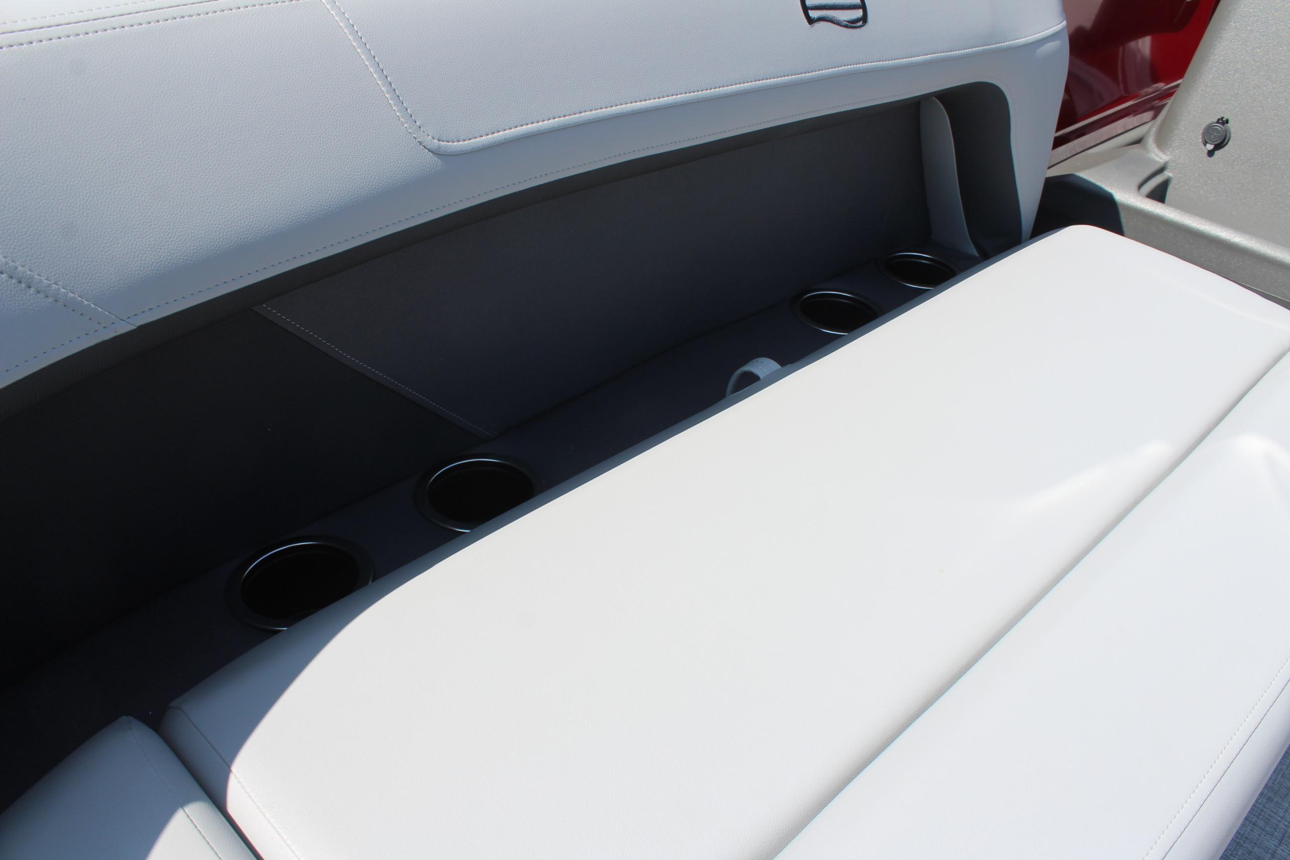 2026 Sun Tracker Party Barge 16 DLX interior seating with cup holders.