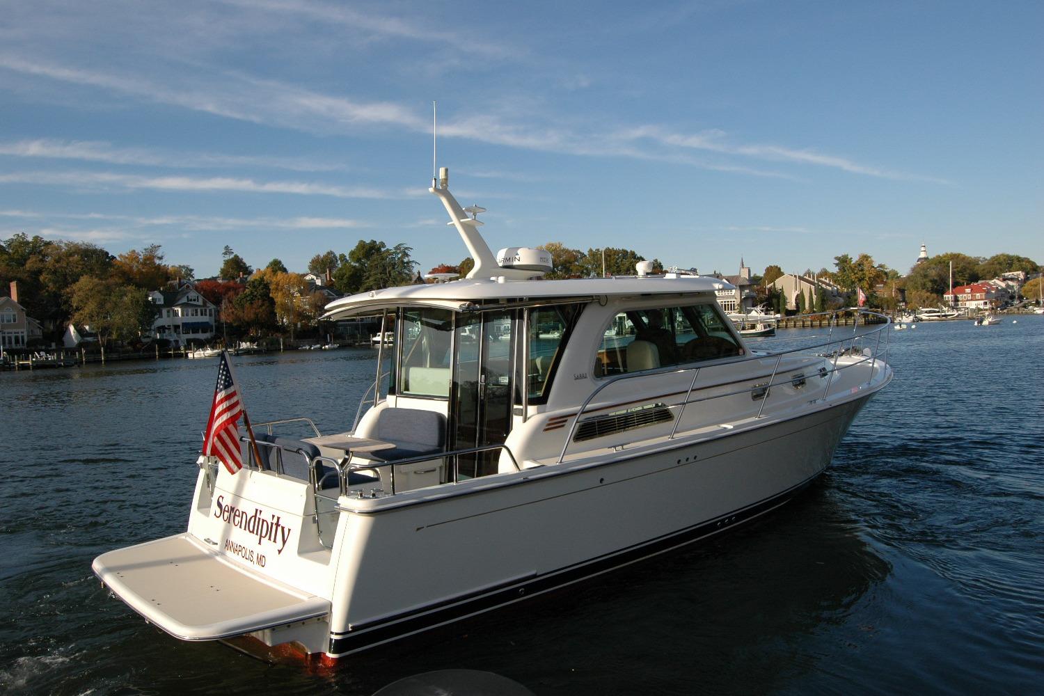 2019 Sabre 38 Salon Express yacht cruising on a scenic waterway.