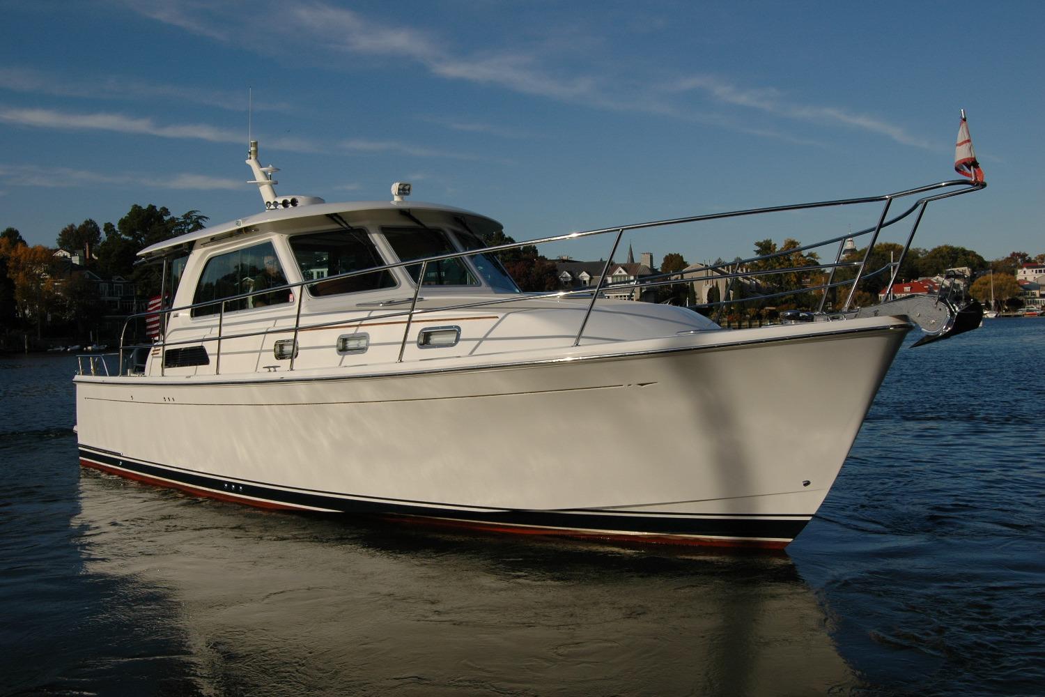 2019 Sabre 38 Salon Express yacht on calm water, showcasing sleek design.