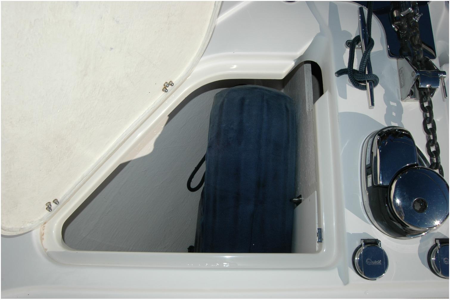 Storage compartment on 2019 Sabre 38 Salon Express boat with marine equipment.