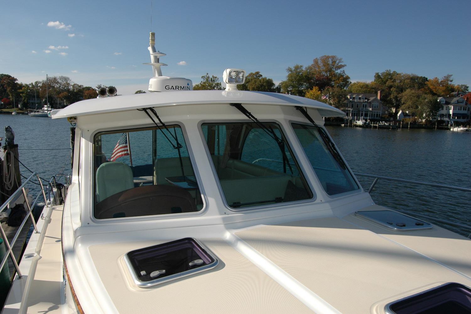 2019 Sabre 38 Salon Express yacht on calm water, showcasing sleek design and modern features.