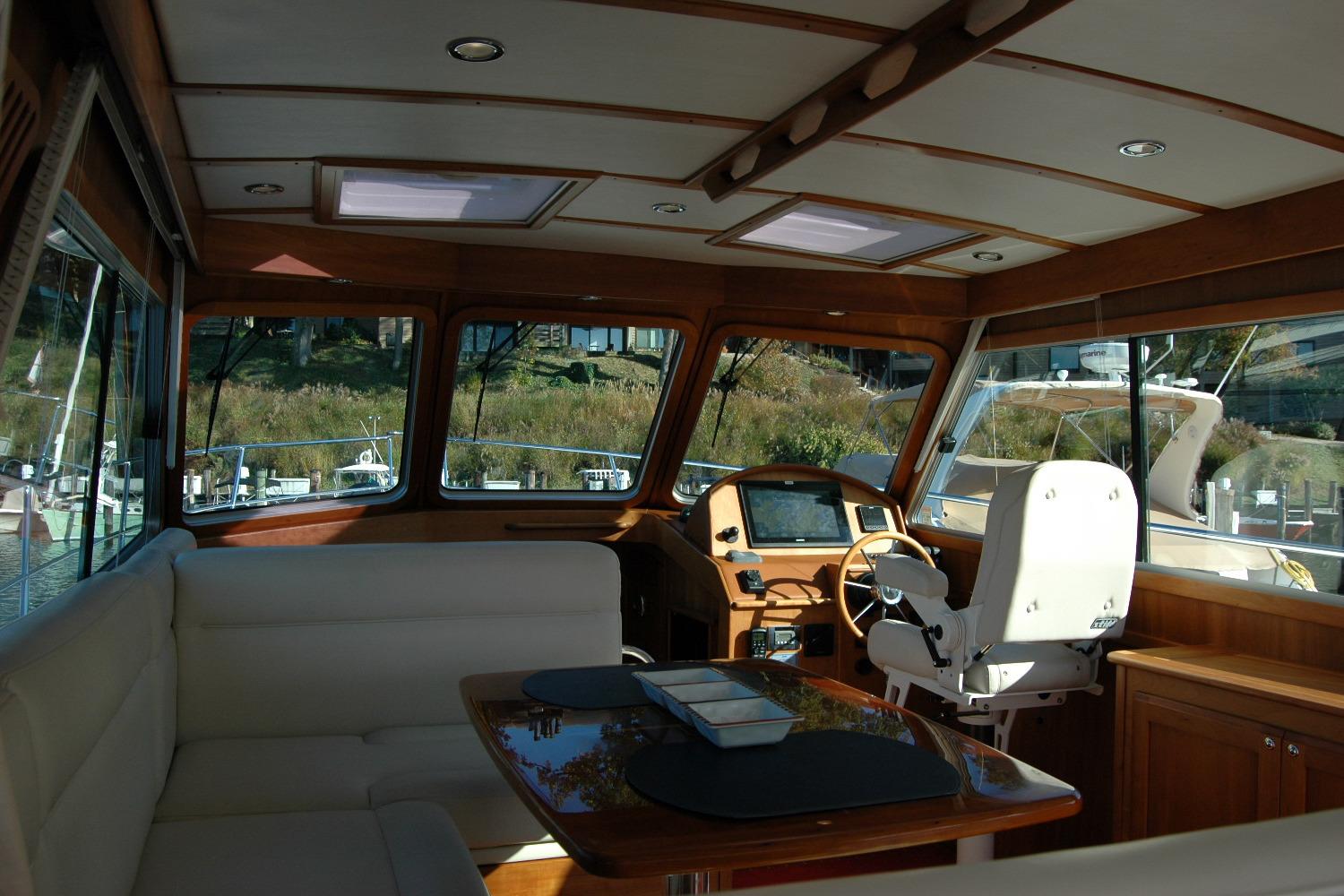 Interior of 2019 Sabre 38 Salon Express yacht with luxurious seating and helm.