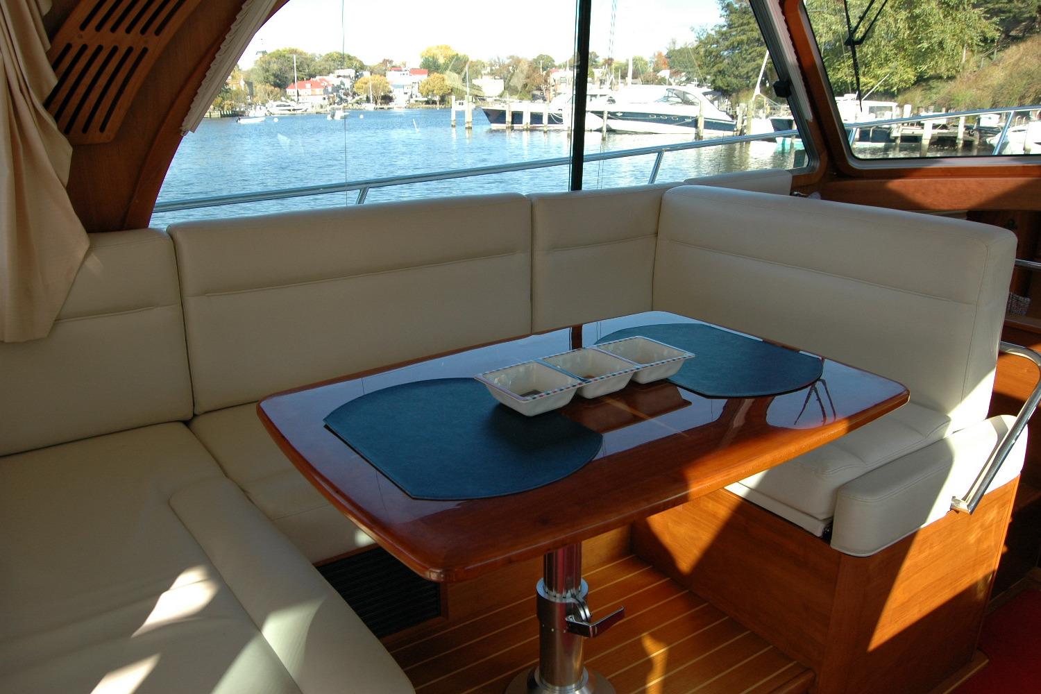 Interior of 2019 Sabre 38 Salon Express yacht with elegant seating and table.