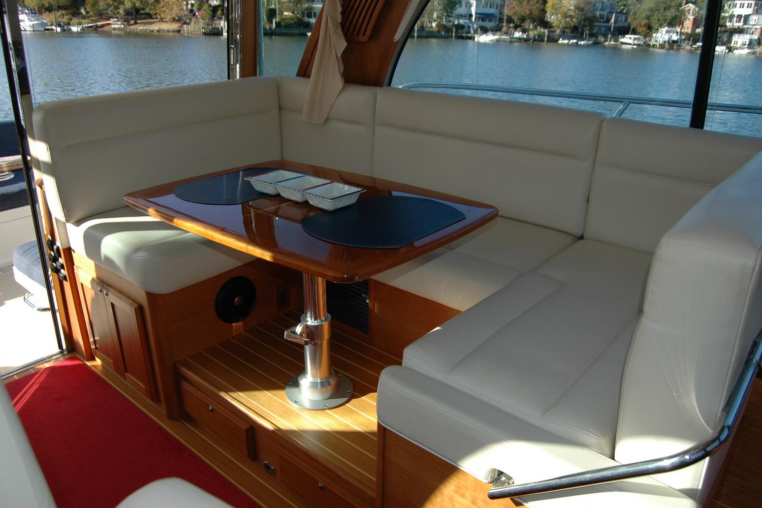 Luxurious interior of 2019 Sabre 38 Salon Express yacht with elegant seating and table.