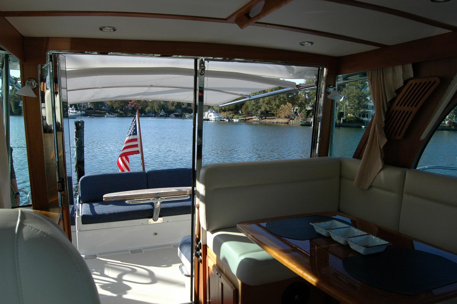 Interior view of 2019 Sabre 38 Salon Express yacht with lake backdrop.