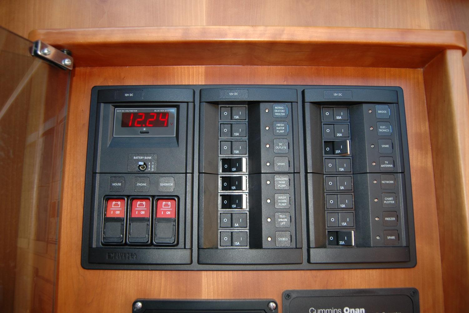 Electrical panel of 2019 Sabre 38 Salon Express yacht, featuring switches and voltage display.