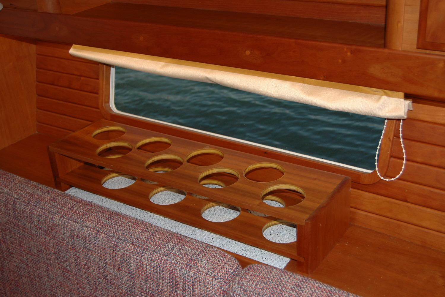 Interior of 2019 Sabre 38 Salon Express with wooden cup holder and window view.