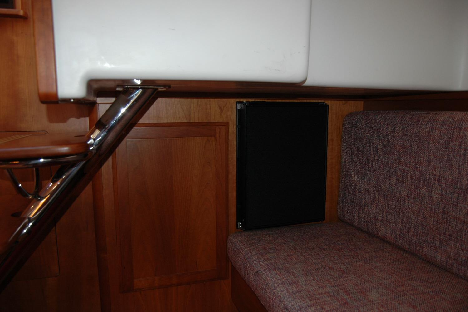 Interior of 2019 Sabre 38 Salon Express with wood paneling and cushioned seating.
