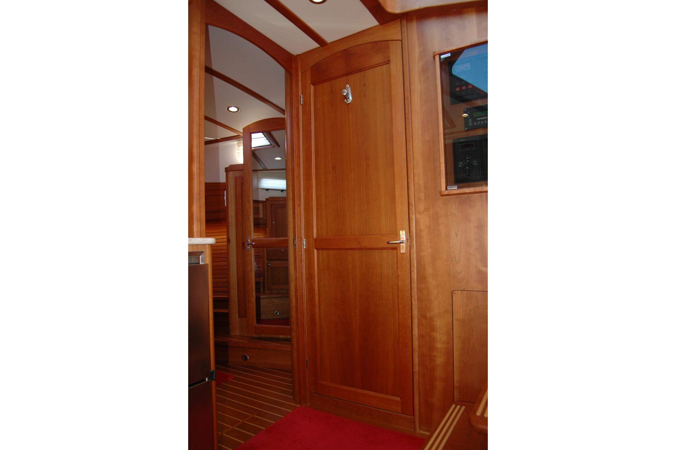 2019 Sabre 38 Salon Express interior with wooden cabinetry and modern design.