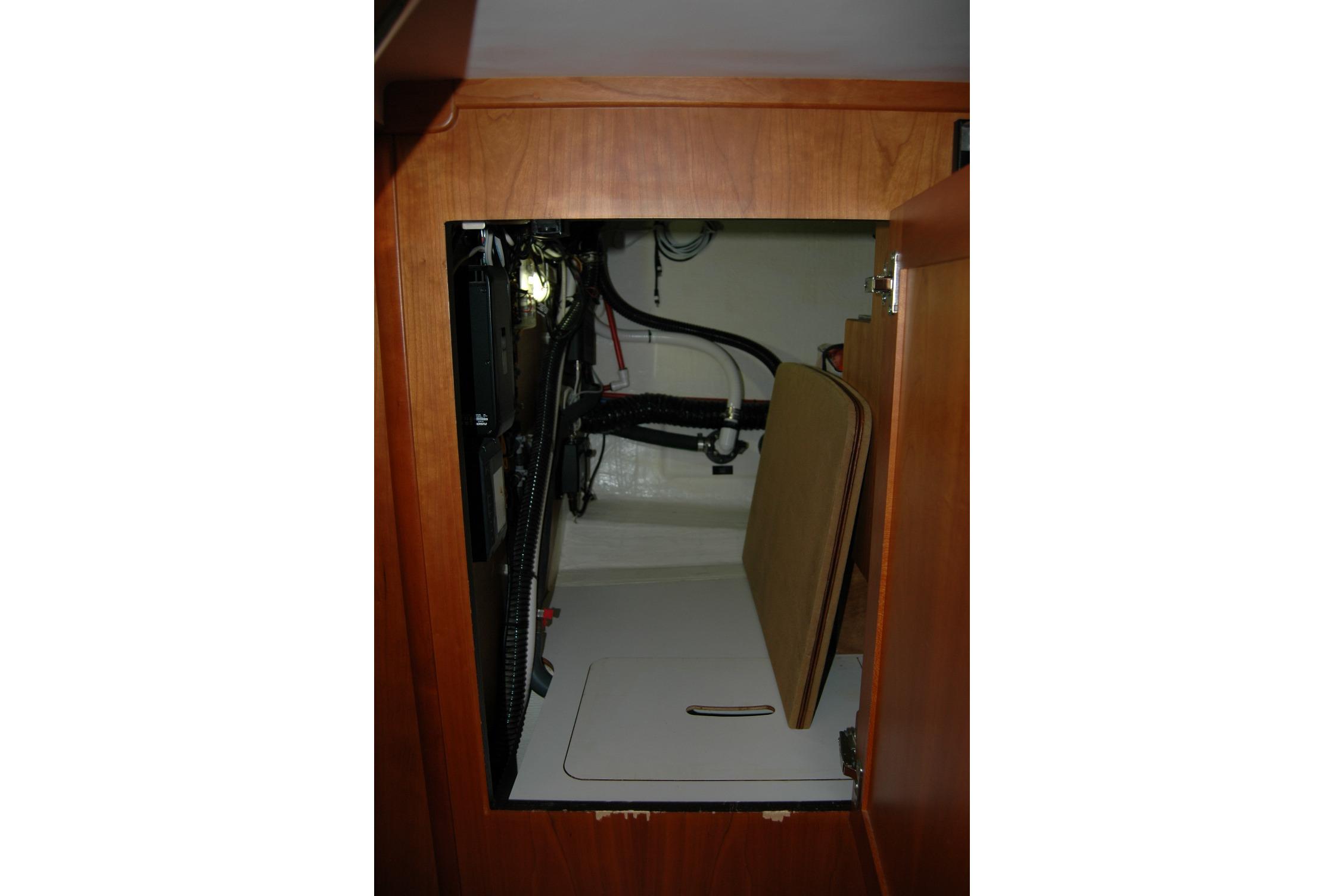 2019 Sabre 38 Salon Express interior storage compartment with wiring and equipment.