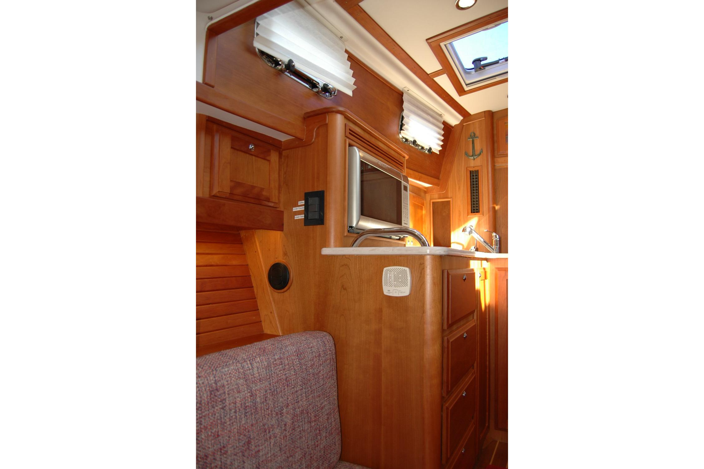 Interior of 2019 Sabre 38 Salon Express yacht with wood cabinetry and modern amenities.