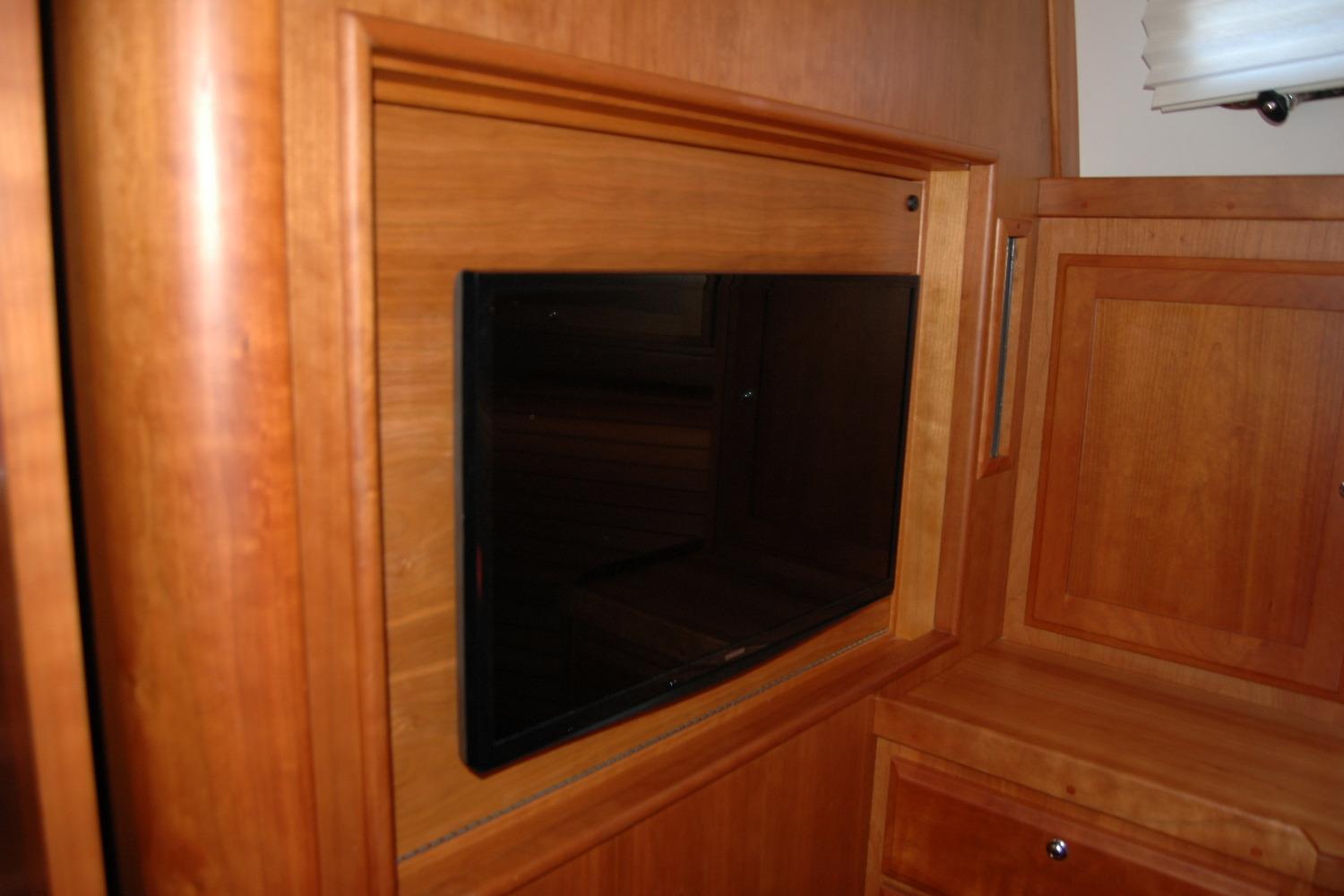 Built-in TV in 2019 Sabre 38 Salon Express yachtu0027s wooden interior.