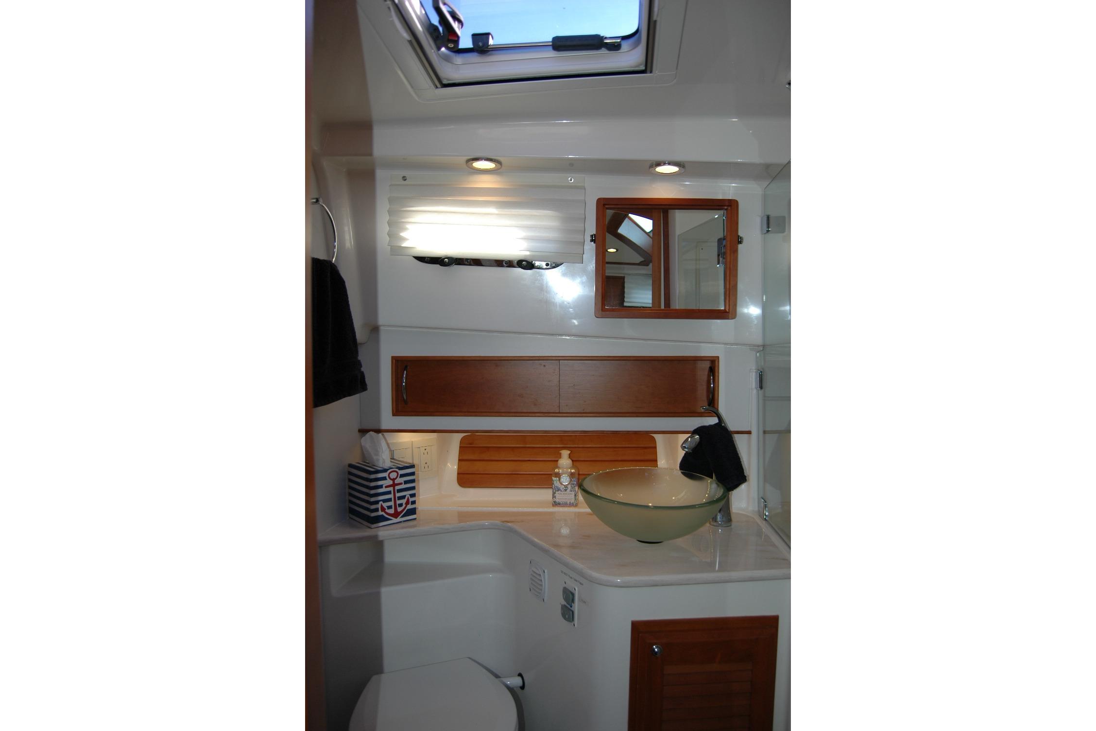 Luxurious bathroom interior of 2019 Sabre 38 Salon Express yacht with modern fixtures.
