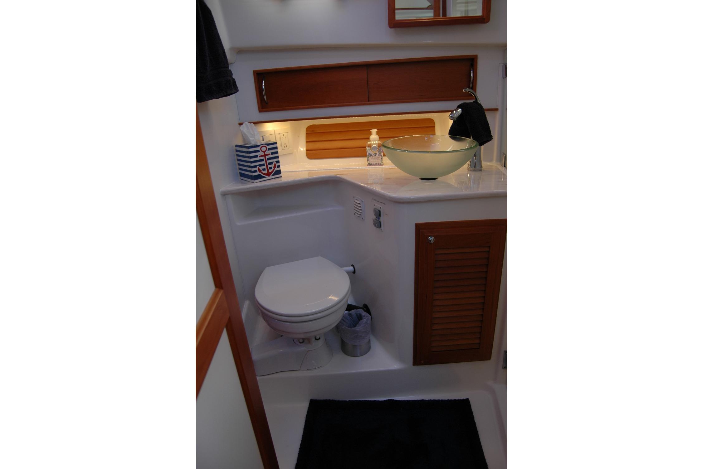 2019 Sabre 38 Salon Express bathroom with modern sink and toilet.