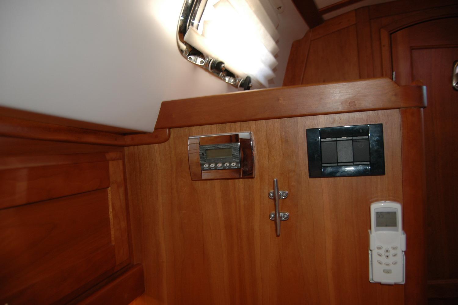 Interior of 2019 Sabre 38 Salon Express with wooden paneling and control panels.