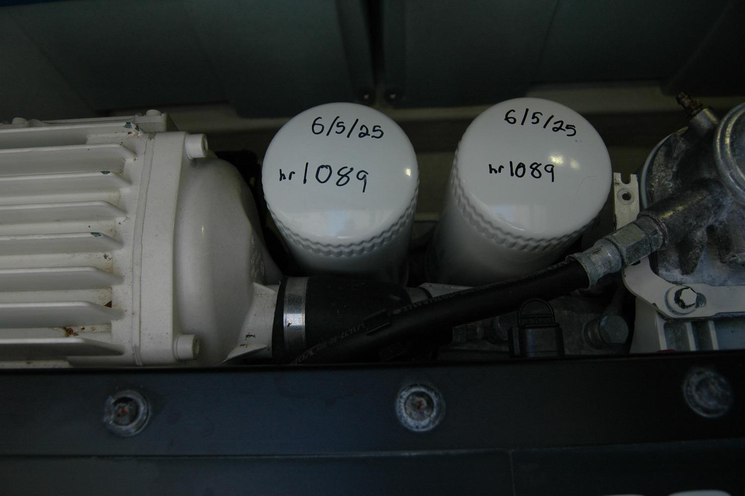 Engine components of 2019 Sabre 38 Salon Express with labeled filters, showing maintenance details.