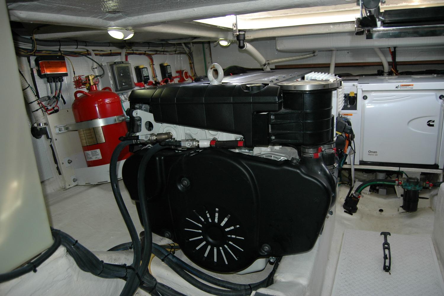 Engine room of 2019 Sabre 38 Salon Express with visible machinery and fire extinguisher.