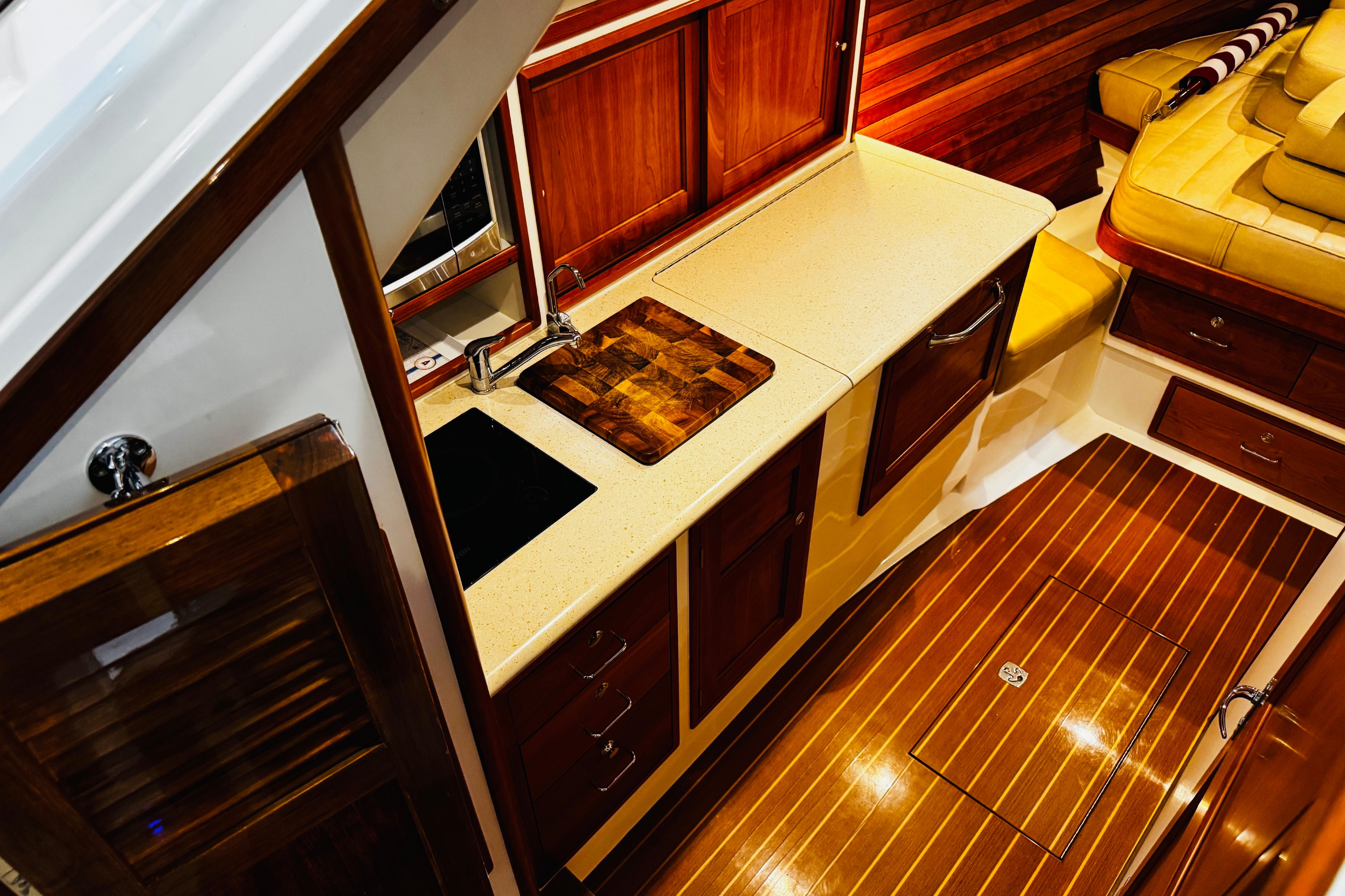 Luxurious interior of 2015 MJM 36z Express yacht with elegant wood finishes and modern amenities.