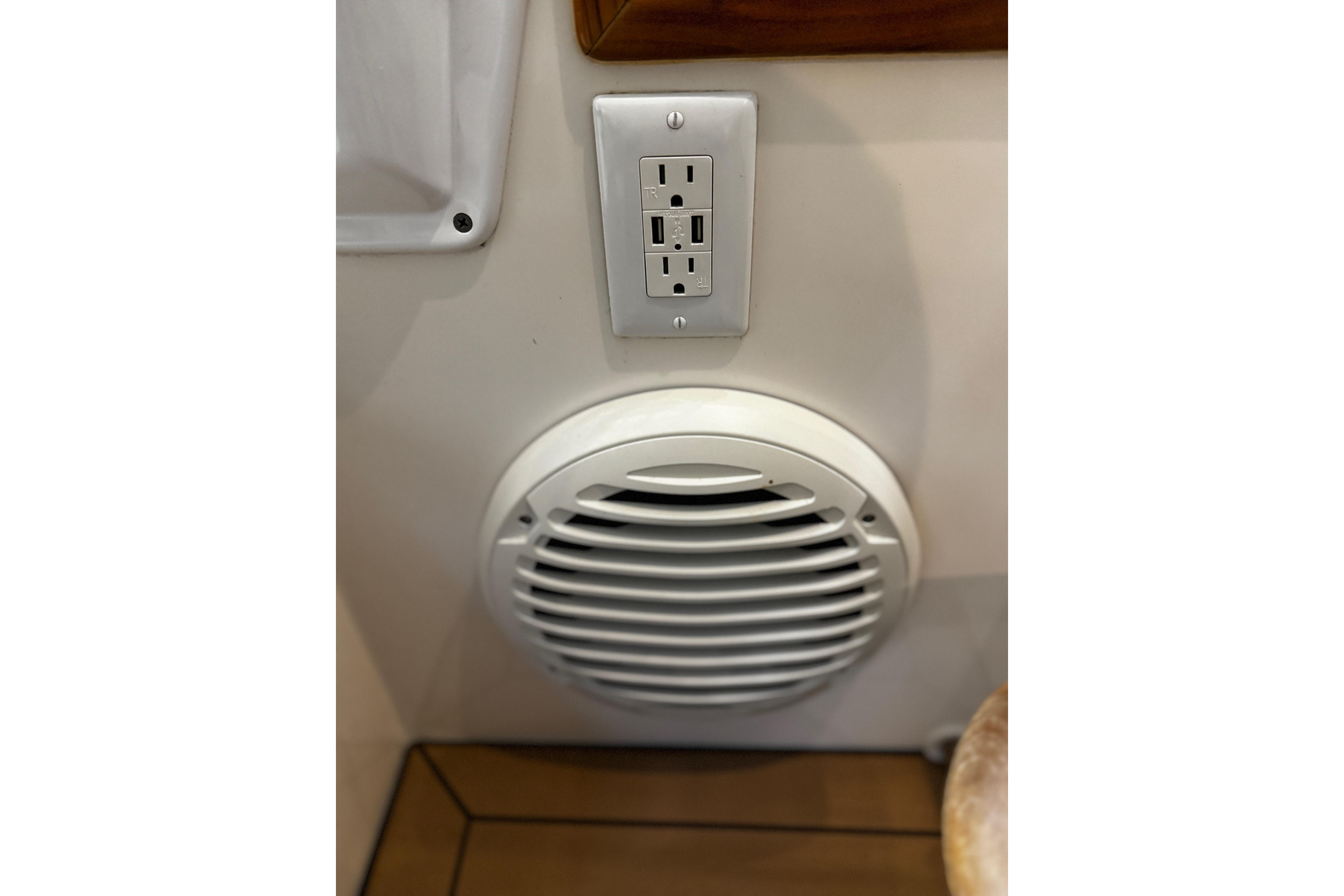 Power outlet and speaker on 2015 MJM 36z Express boat interior.