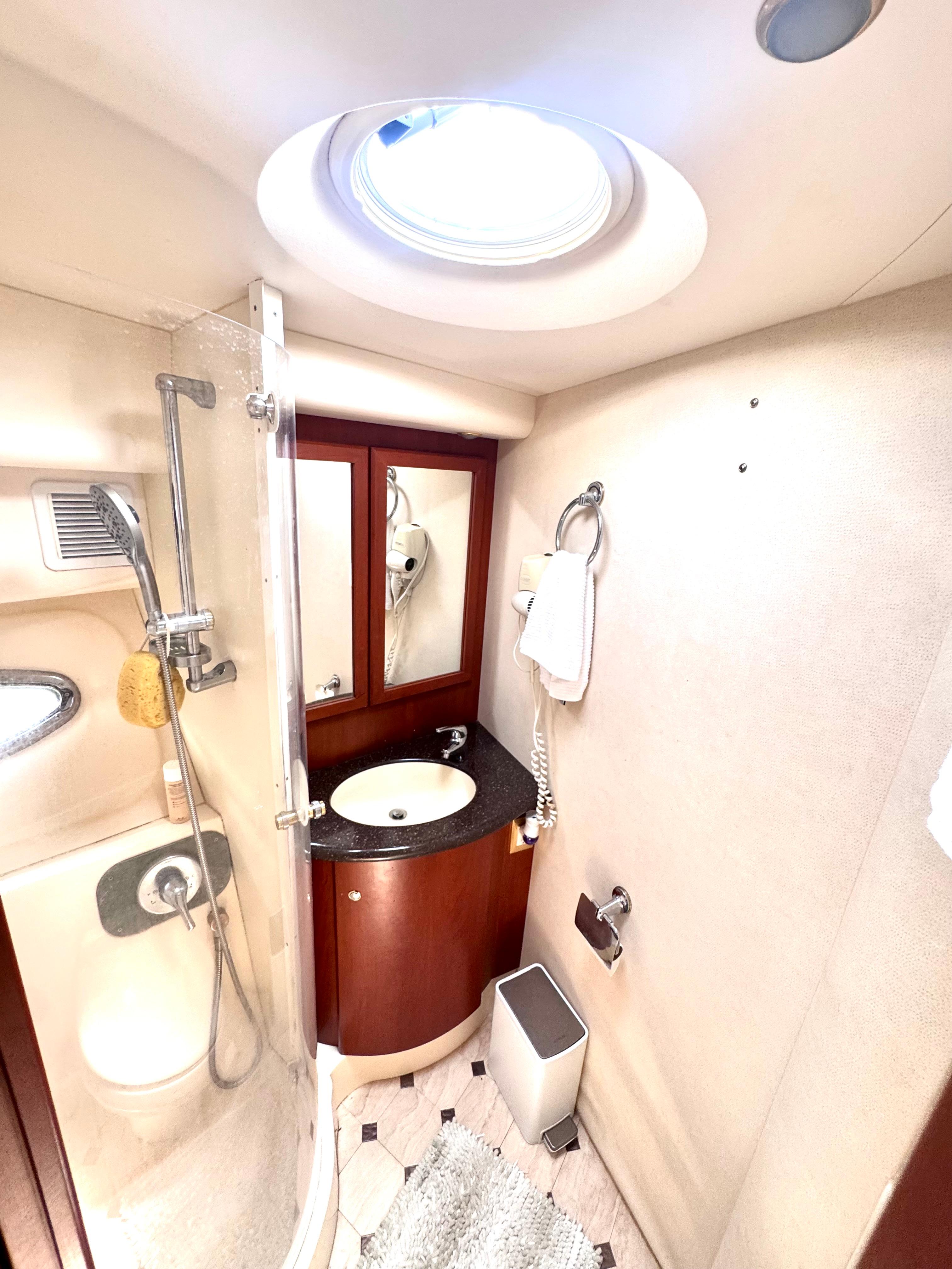 Picture of A Whole New World Silverton 51.58 ft' 50 Convertible Luxurious bathroom in 2006 Silverton 50 Convertible yacht with shower and vanity. 