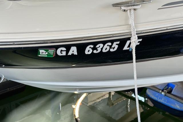 2002 Sea Ray 240 Sundeck boat with registration GA 6365 LF docked.