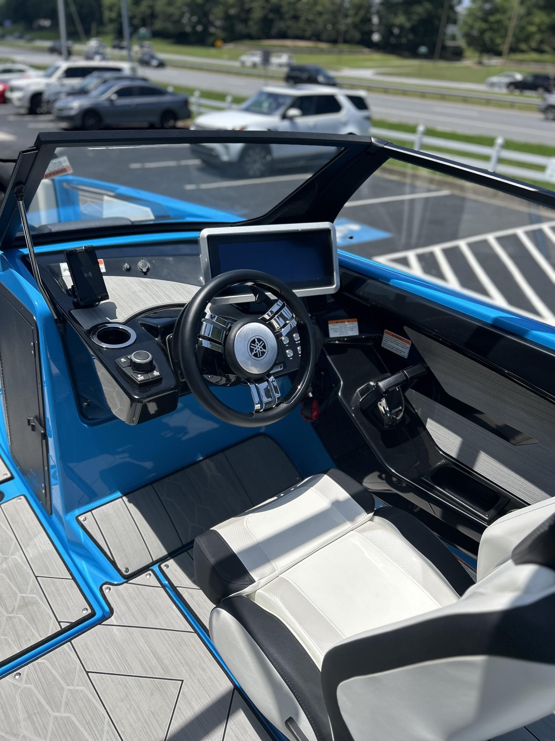 2023 Yamaha Boats 222 XD cockpit with modern steering and navigation display.