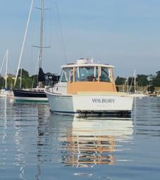 Hunt Yachts-Surfhunter 33 2006-Wilbury NY-US-2006 Hunt Yachts Surfhunter 33 on calm water, named WILBURY, with sailboats in the background.-9496692 | Thumbnail