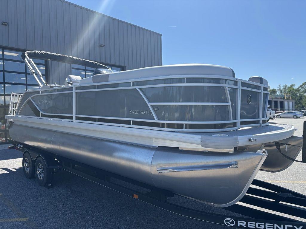 2025 Godfrey Sweetwater 2286 SFLC pontoon boat on trailer, outdoor display.