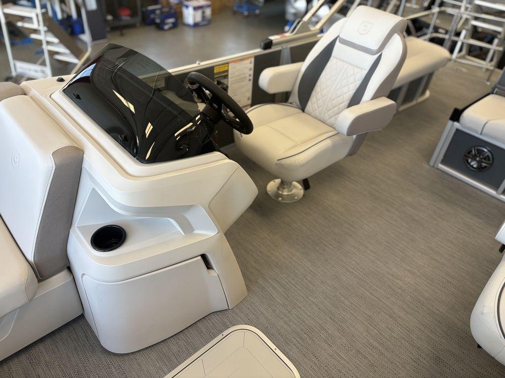 2025 Godfrey Sweetwater 2286 SFLC boat interior with modern helm and comfortable seating.