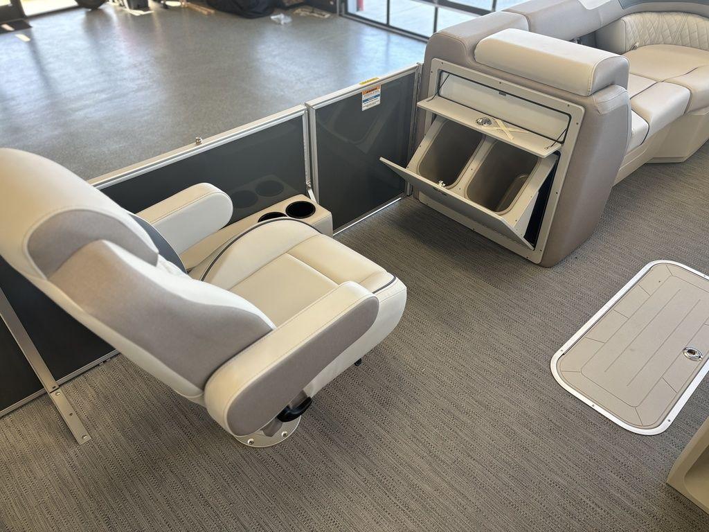 2025 Godfrey Sweetwater 2286 SFLC boat interior with seating and storage compartments.