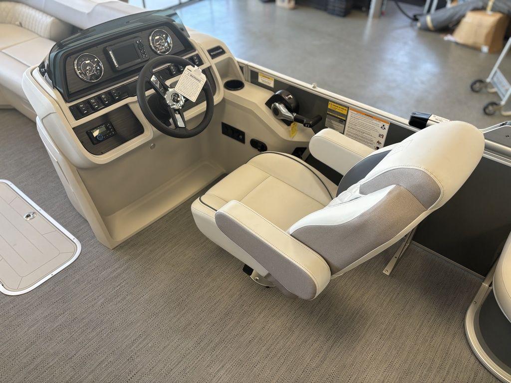 Captain's seat and dashboard of 2025 Godfrey Sweetwater 2286 SFLC pontoon boat.