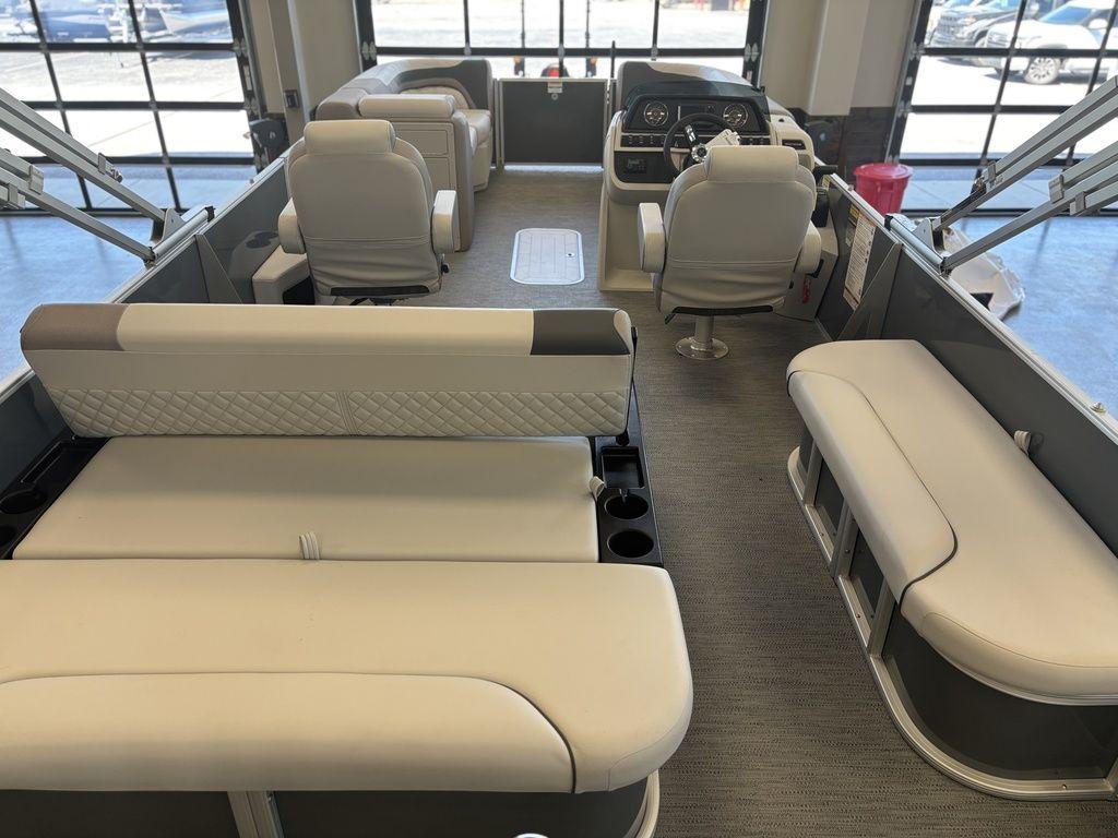 Interior of 2025 Godfrey Sweetwater 2286 SFLC pontoon boat with plush seating and modern helm.