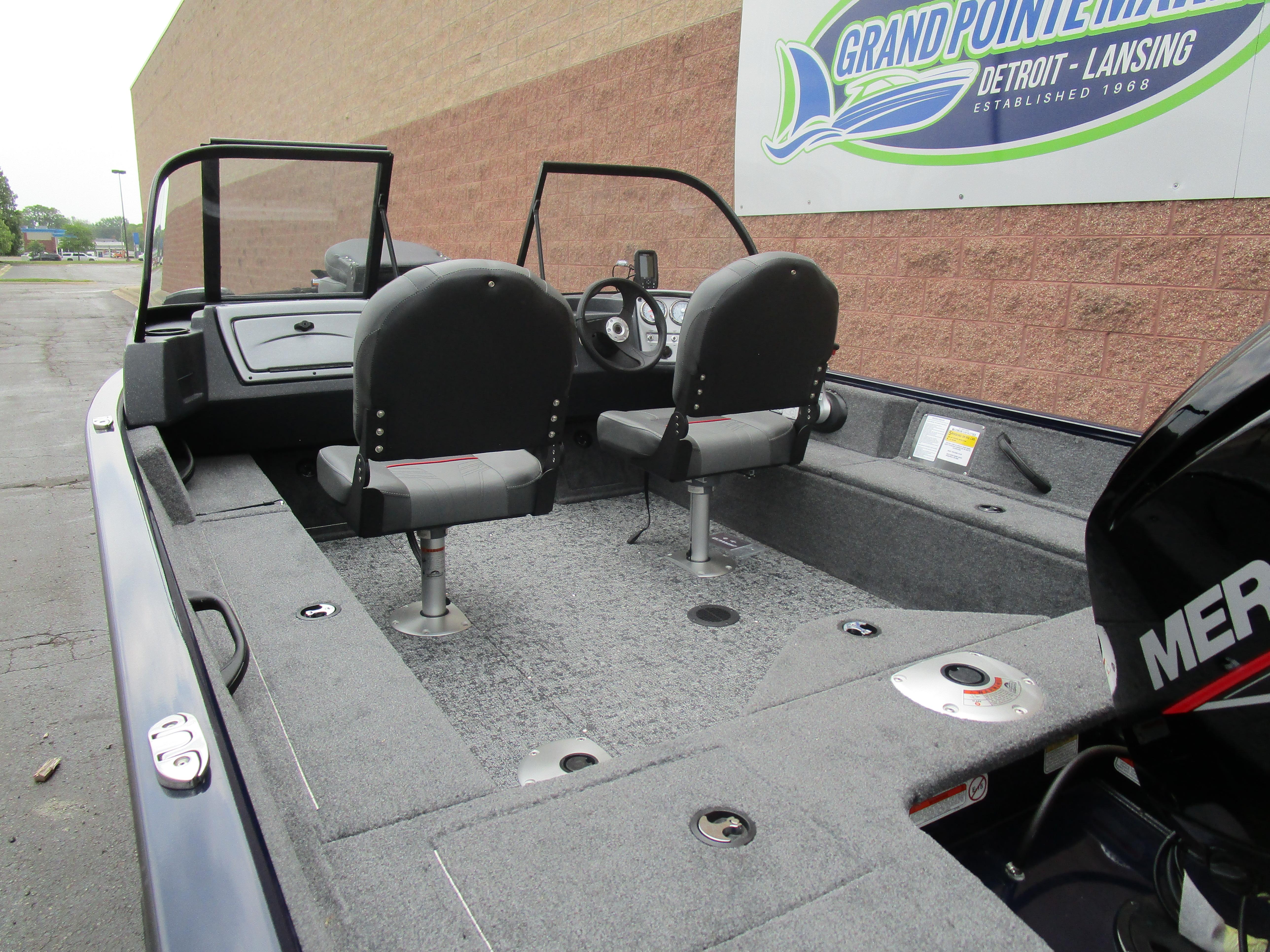 2025 Tracker Pro Guide V16 WT boat interior with dual seats and steering console.