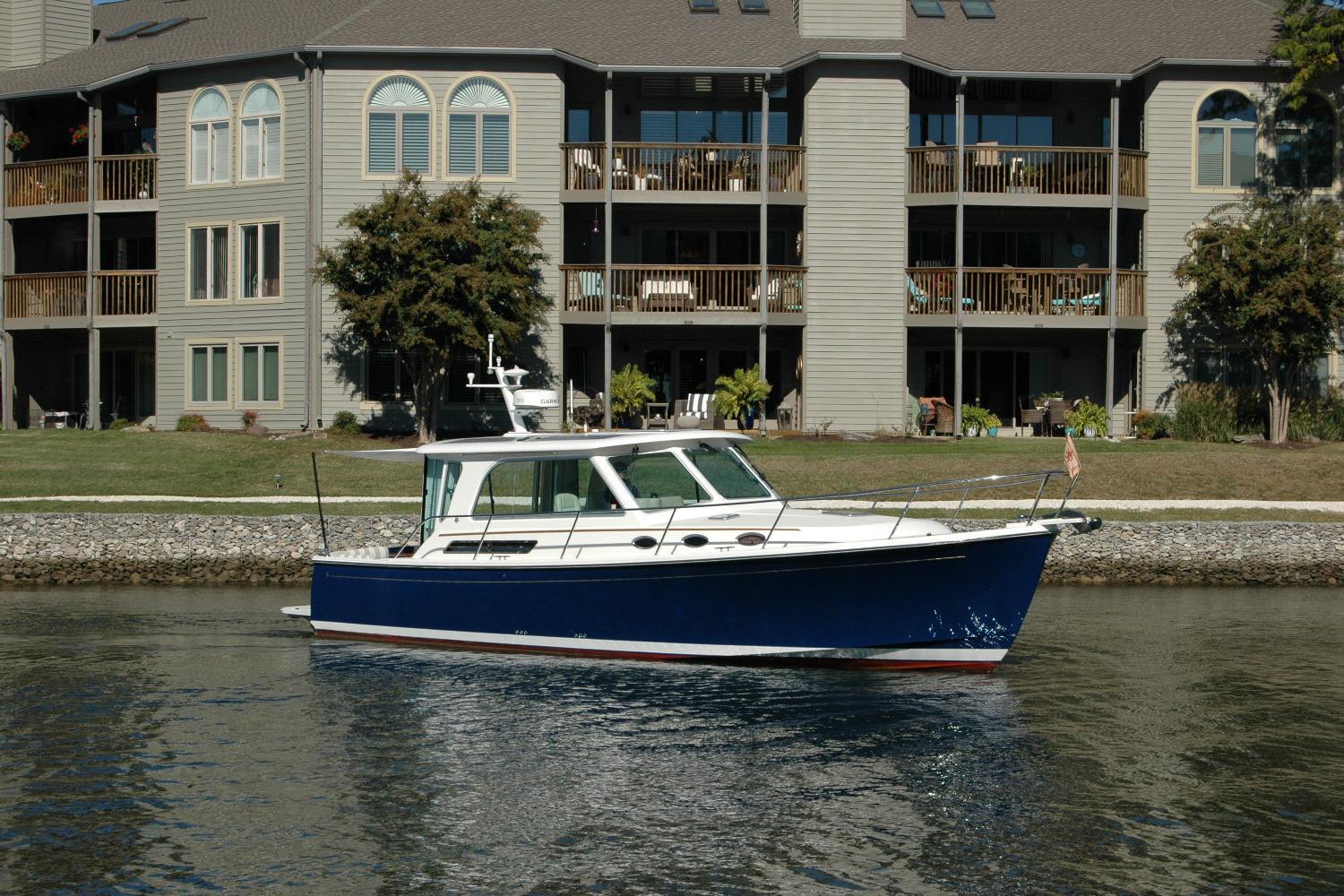 2015 Back Cove 37 boat on water near residential building.