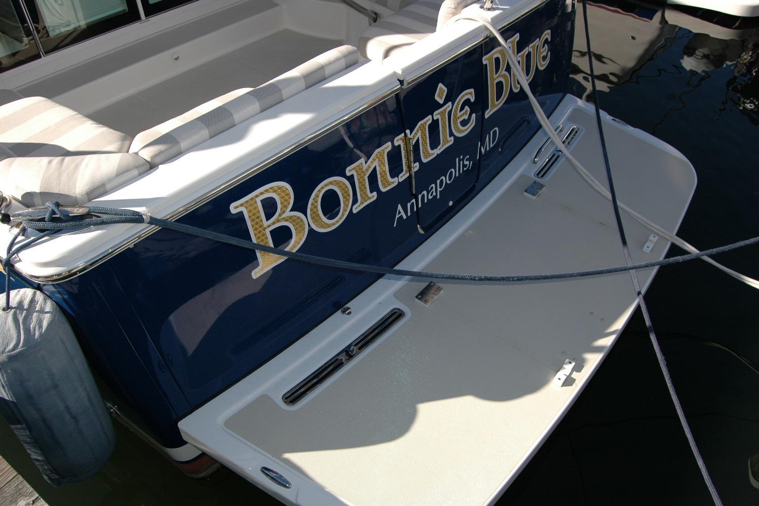 2015 Back Cove 37 boat stern with name and location, docked in water.
