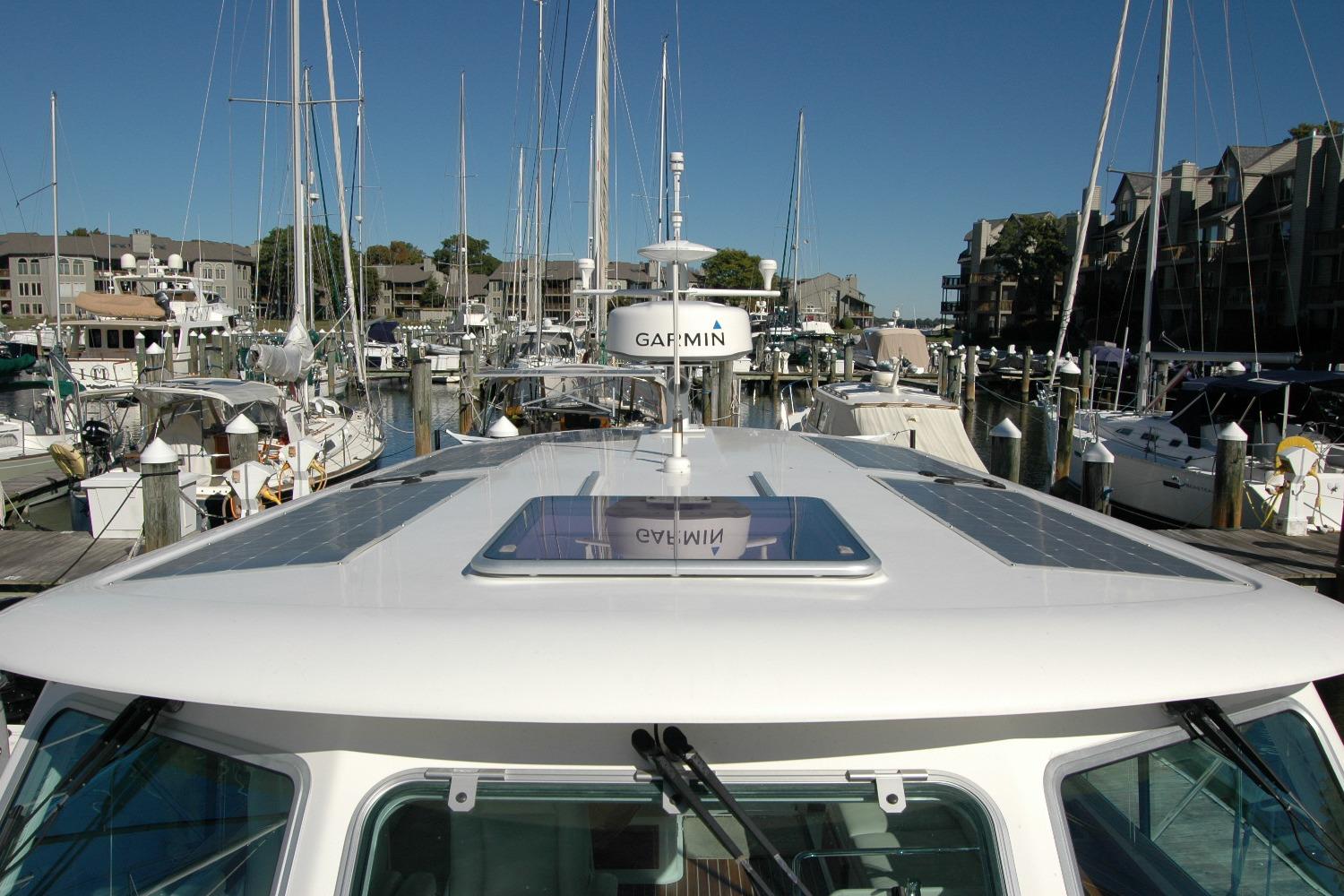 2015 Back Cove 37 yacht docked in a marina, featuring Garmin equipment.