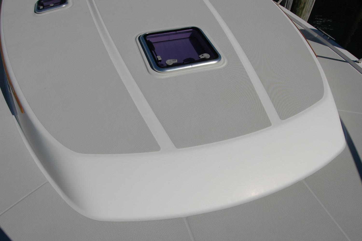 2015 Back Cove 37 boat deck with hatch, showcasing sleek design and craftsmanship.