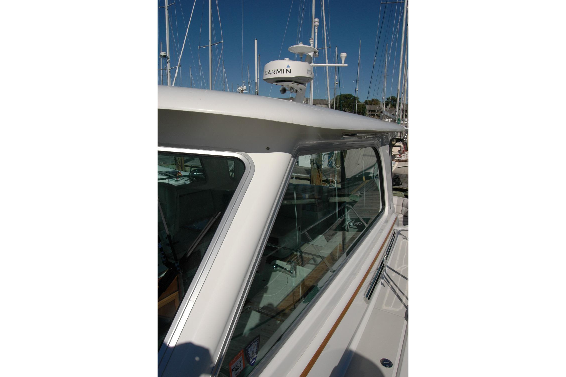 2015 Back Cove 37 boat with Garmin radar, docked in a marina.