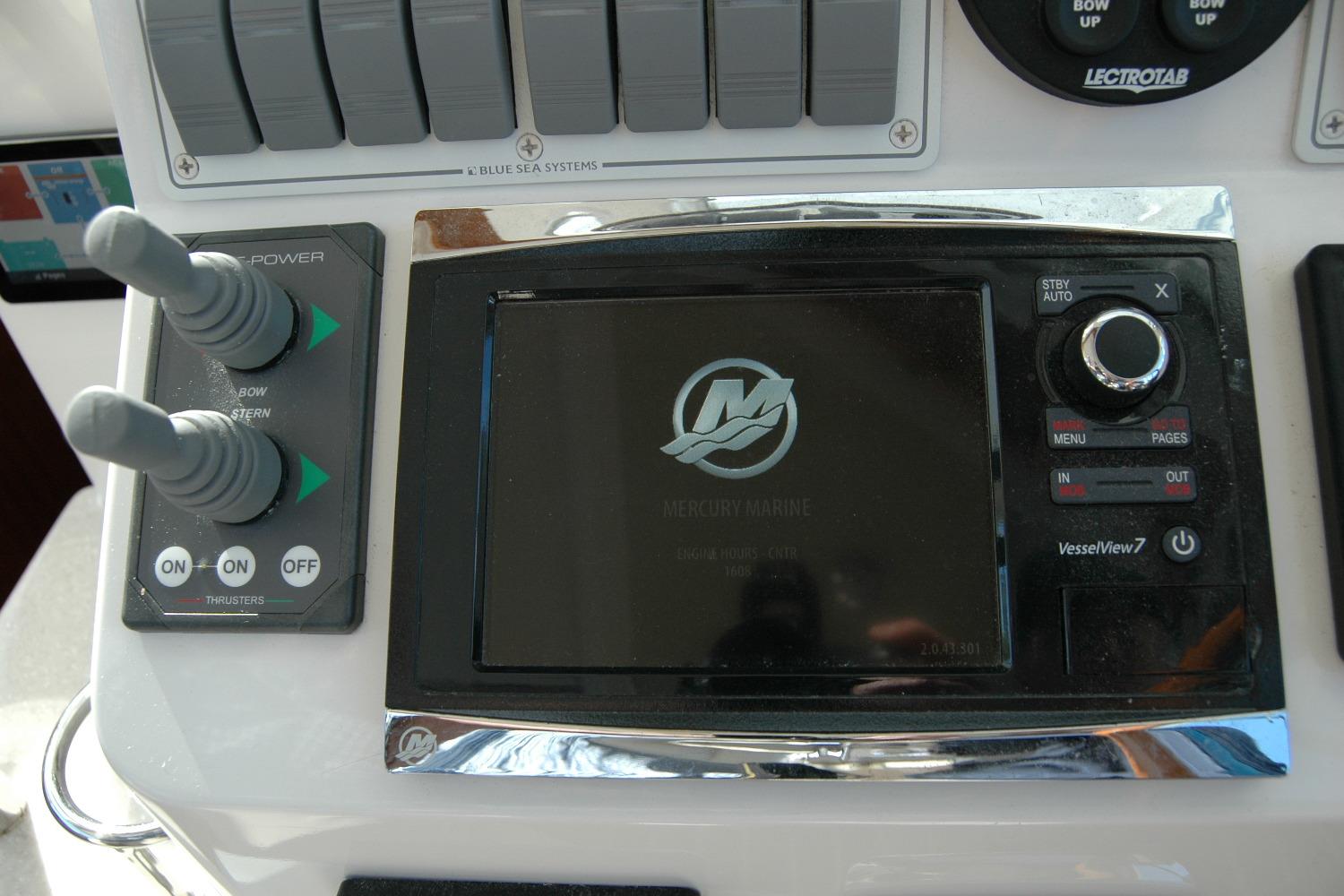 Control panel of a 2015 Back Cove 37 boat with Mercury Marine display.
