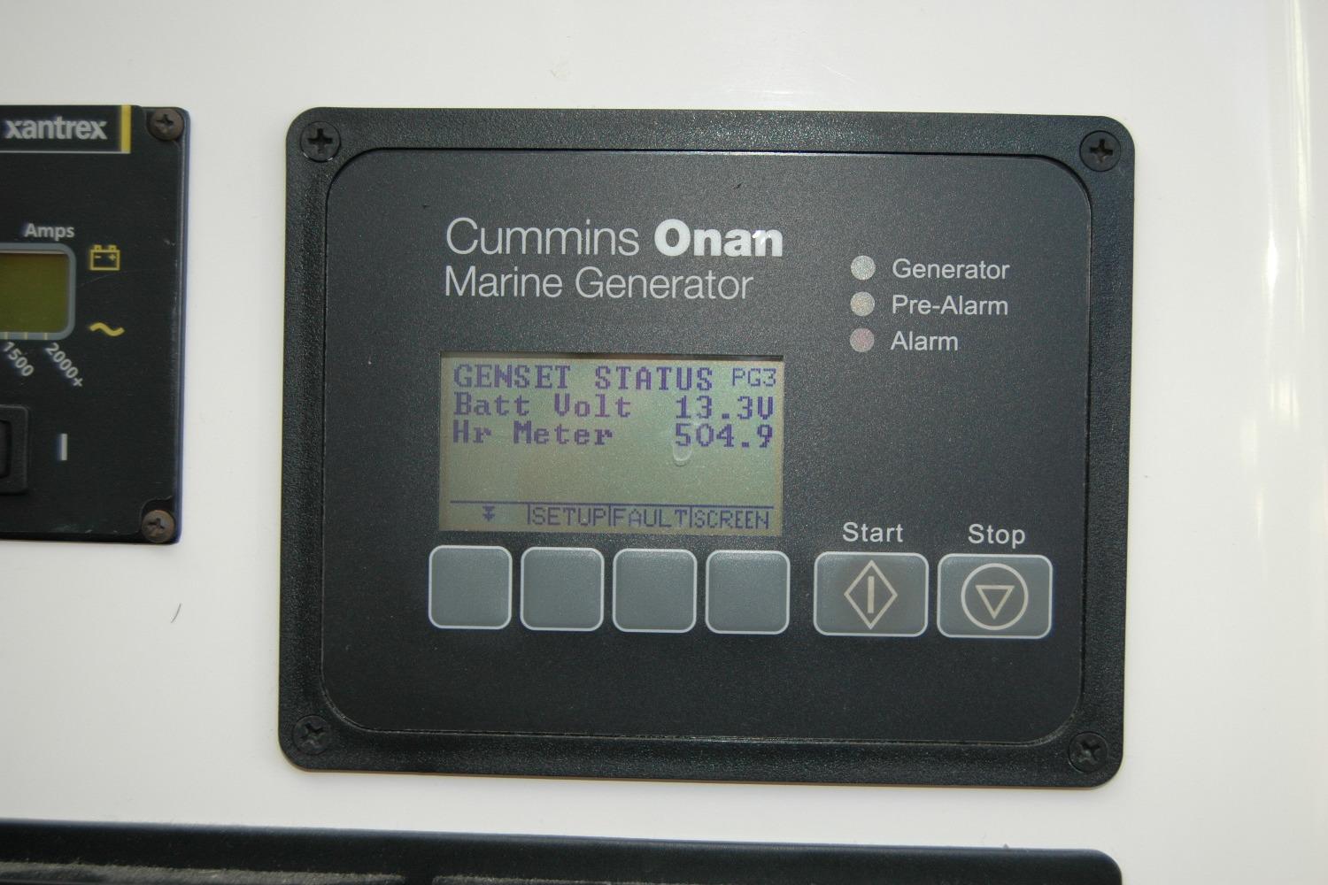 Cummins Onan marine generator display on 2015 Back Cove 37, showing battery voltage and hour meter.