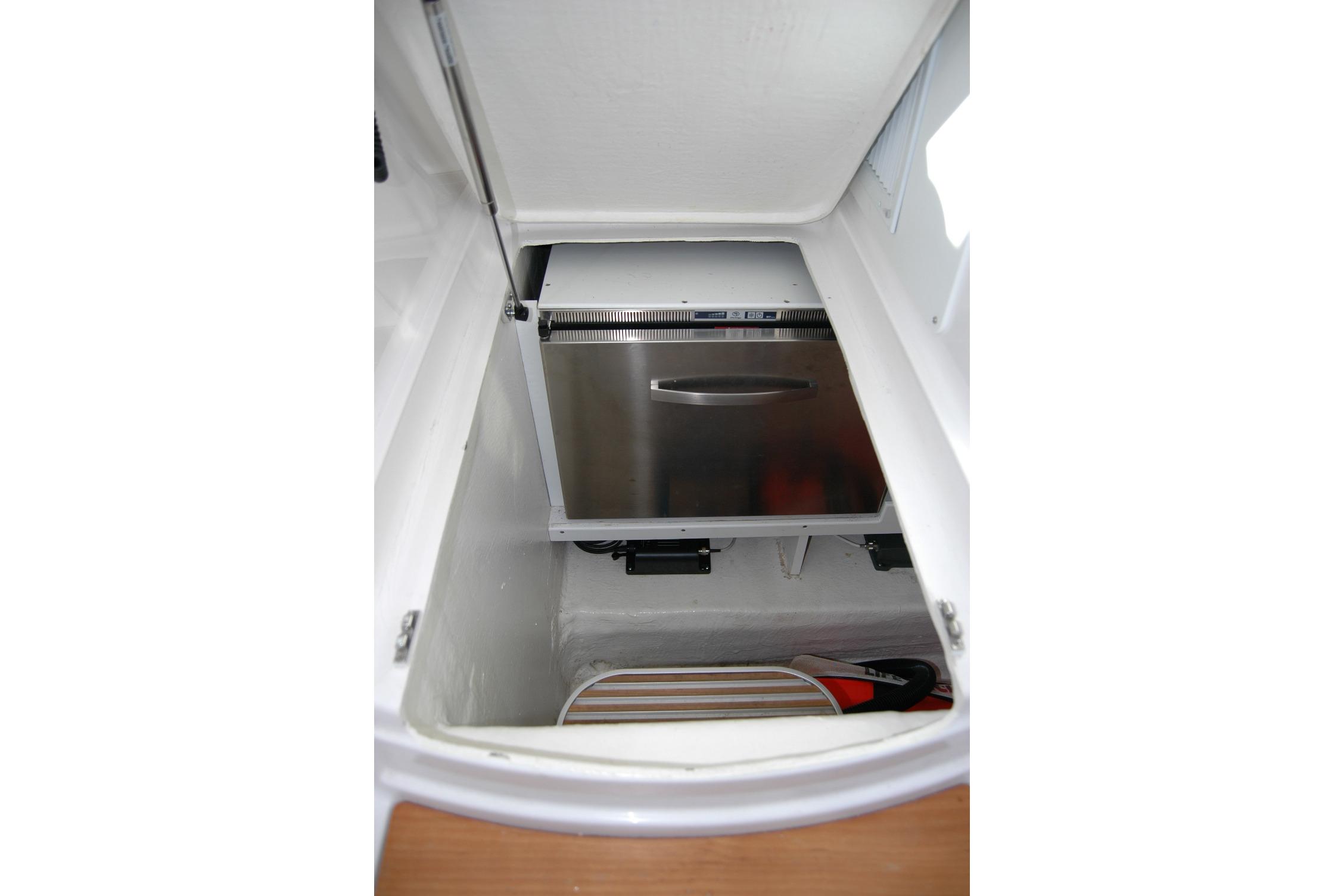 2015 Back Cove 37 boat storage compartment with stainless steel appliance.