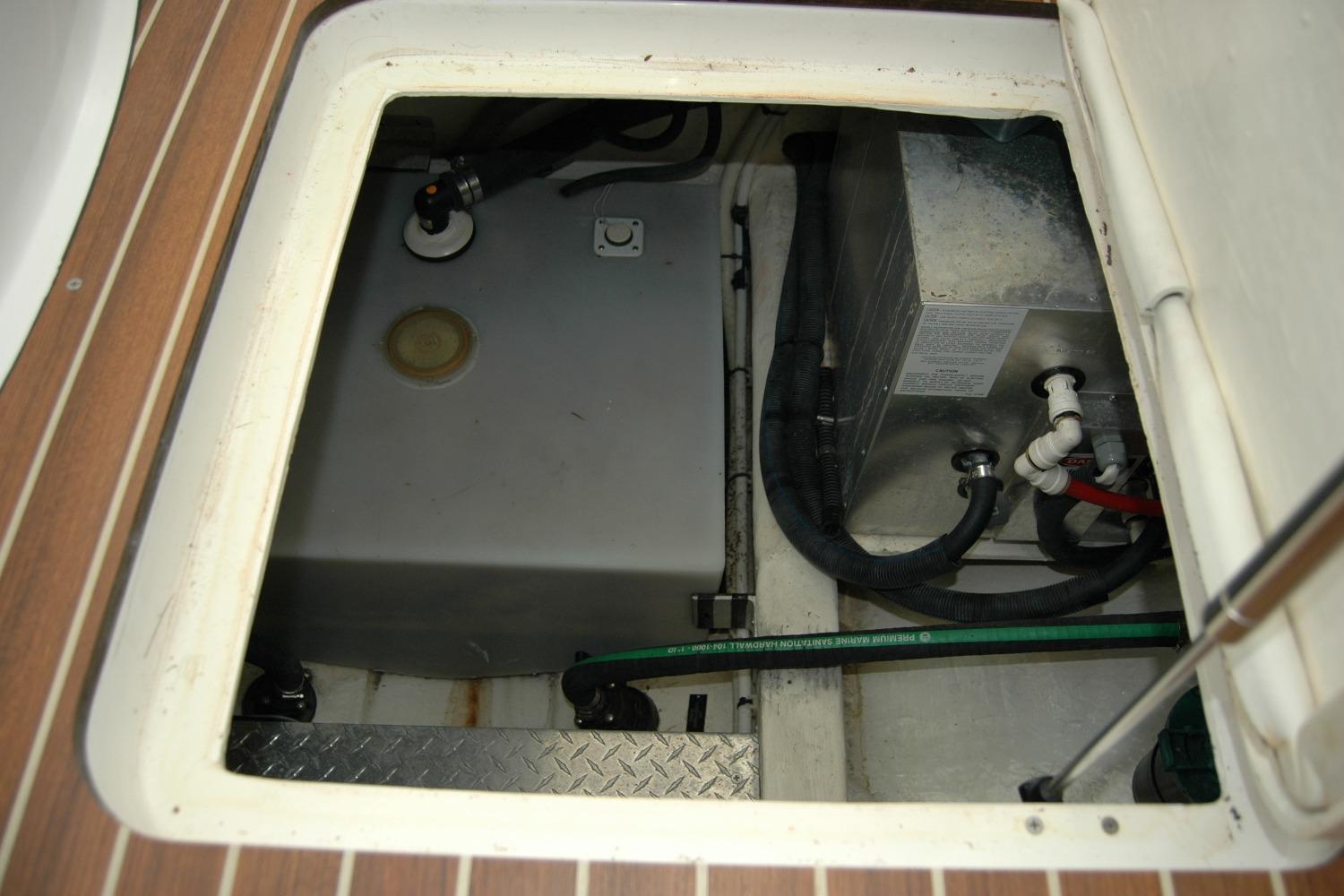 2015 Back Cove 37 engine compartment with visible fuel tank and hoses.