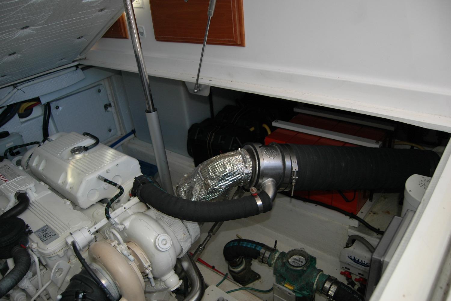 Engine compartment of a 2015 Back Cove 37 boat, showcasing mechanical components.