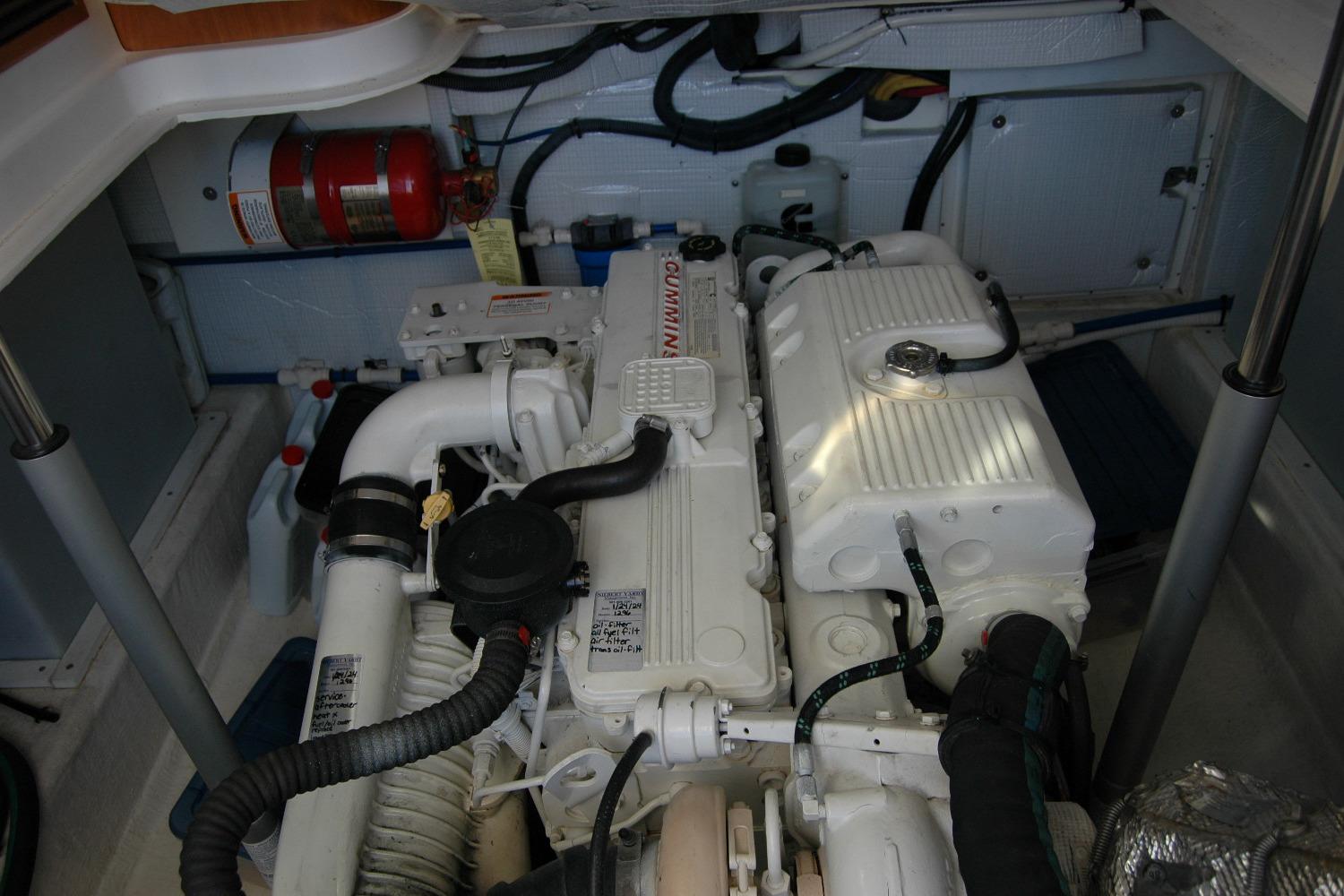 Engine compartment of a 2015 Back Cove 37 boat, featuring a clean, organized layout.