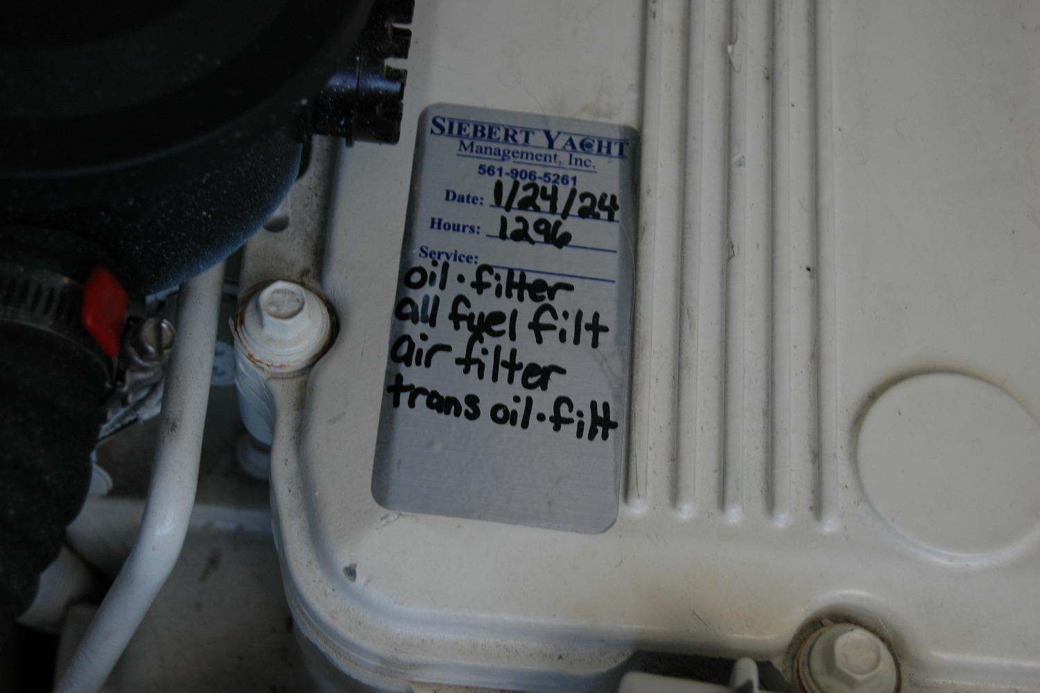 Maintenance label on a 2015 Back Cove 37 engine, listing filter services.