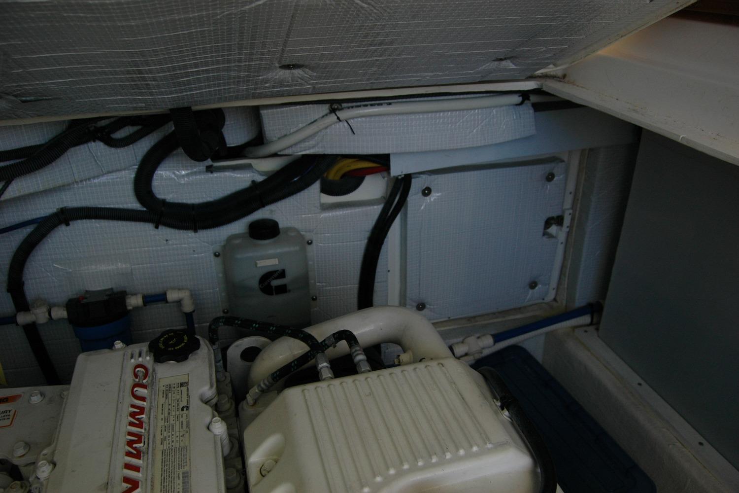 Engine compartment of a 2015 Back Cove 37 boat, featuring Cummins components.