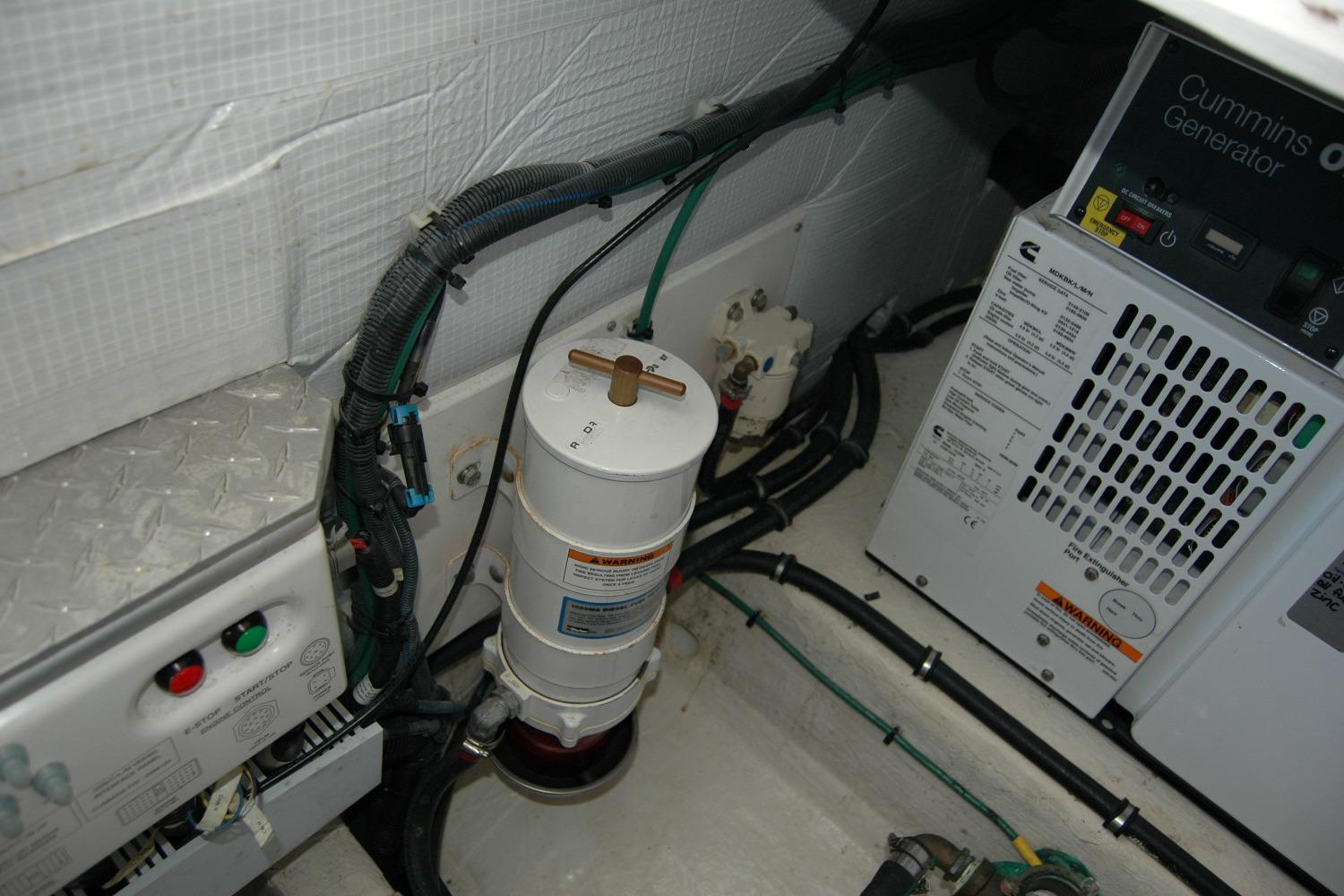 Engine room of 2015 Back Cove 37 with Cummins generator and wiring.
