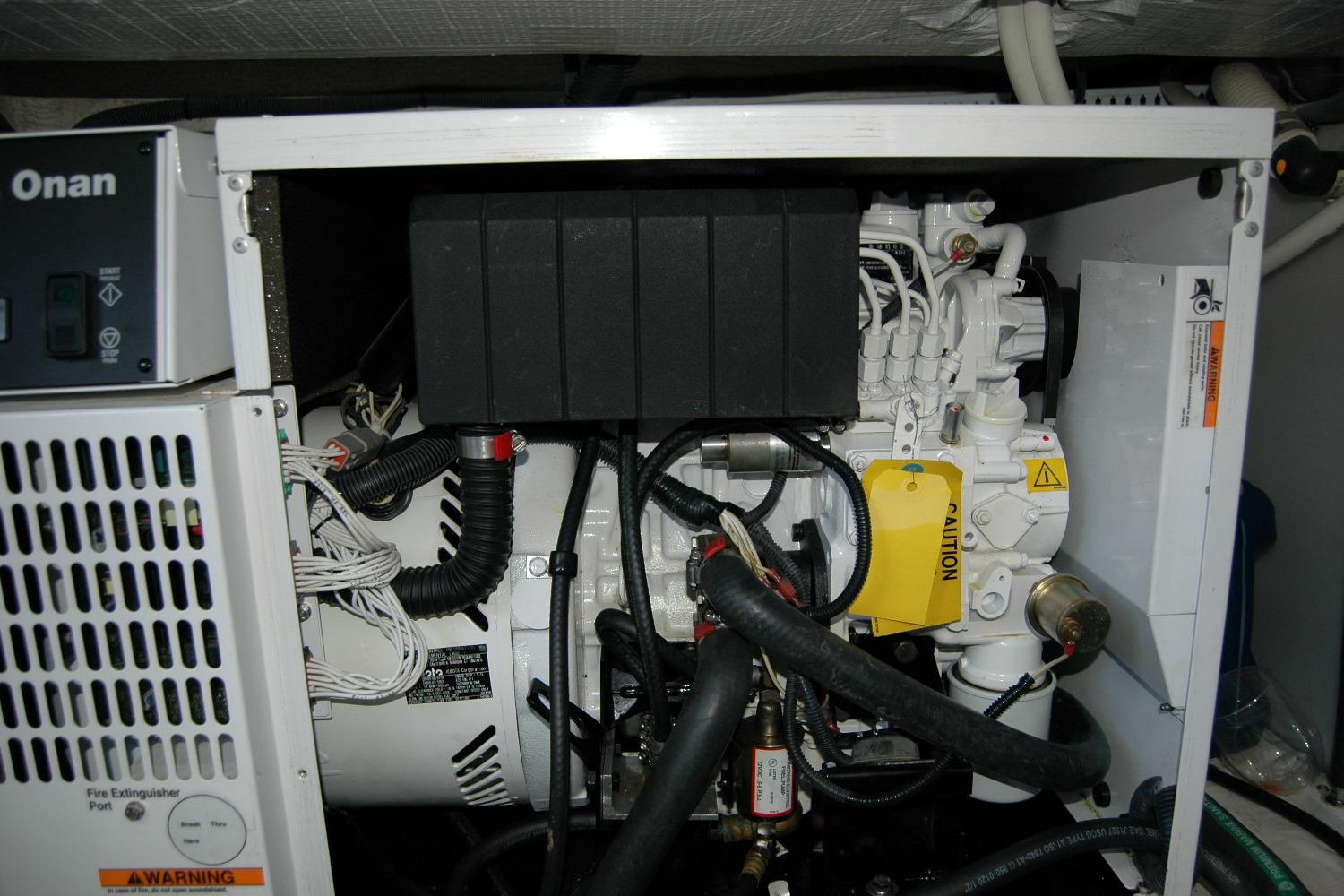 Engine compartment of a 2015 Back Cove 37 boat featuring an Onan generator.